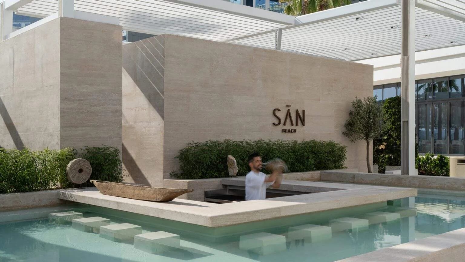 SĀN Beach Dubai pool and minimalist stone architecture at Palm West Beach
