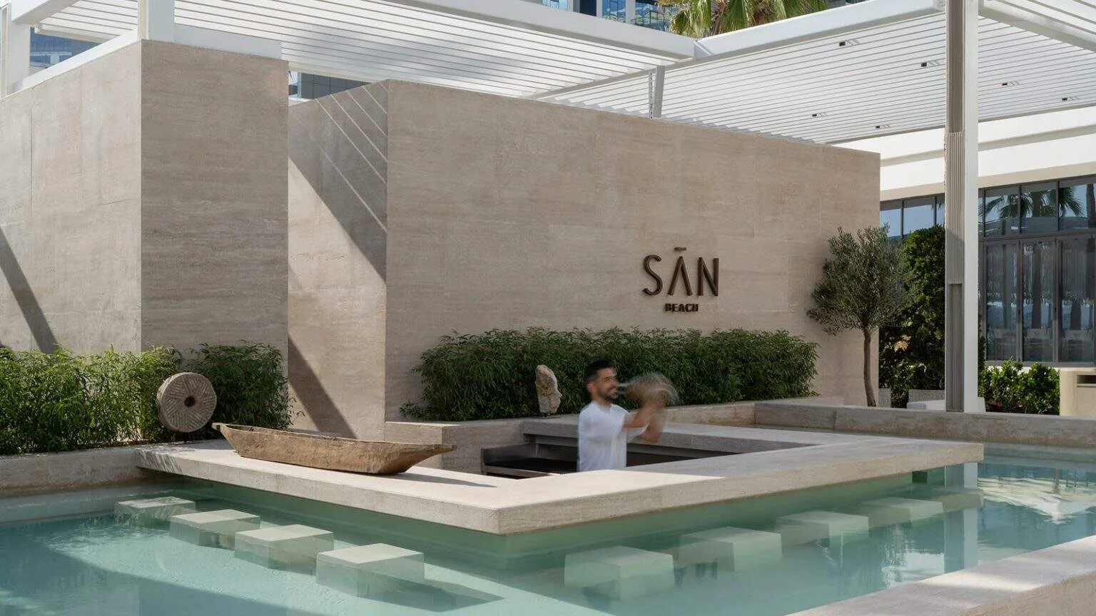 SĀN Beach Dubai pool and minimalist stone architecture at Palm West Beach