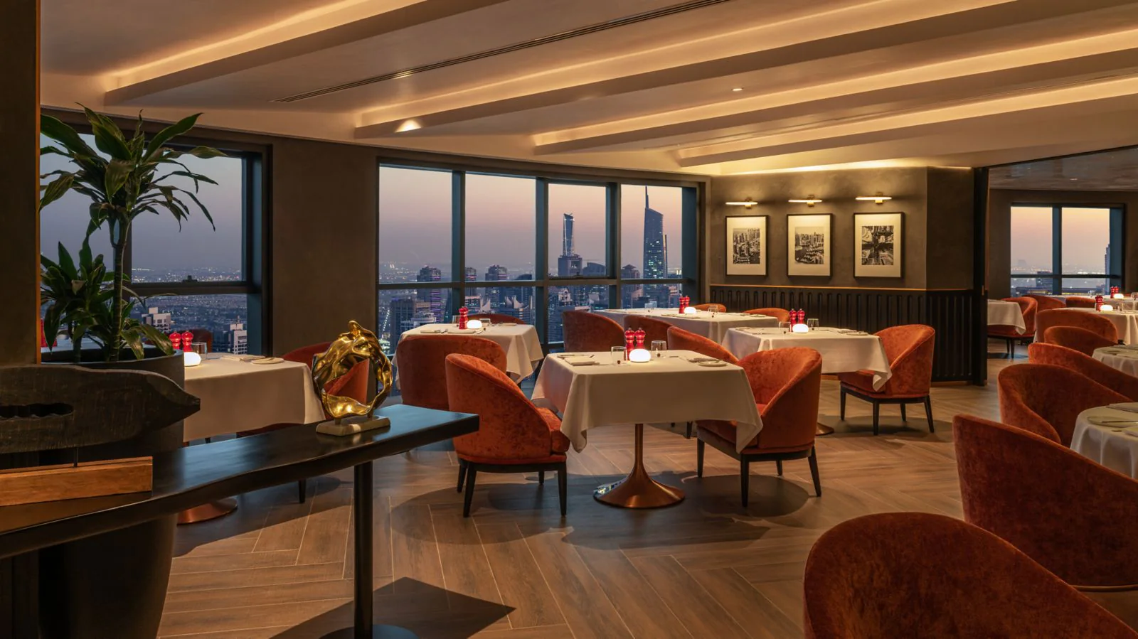 Prime52 steakhouse window tables overlooking Dubai Marina at sunset